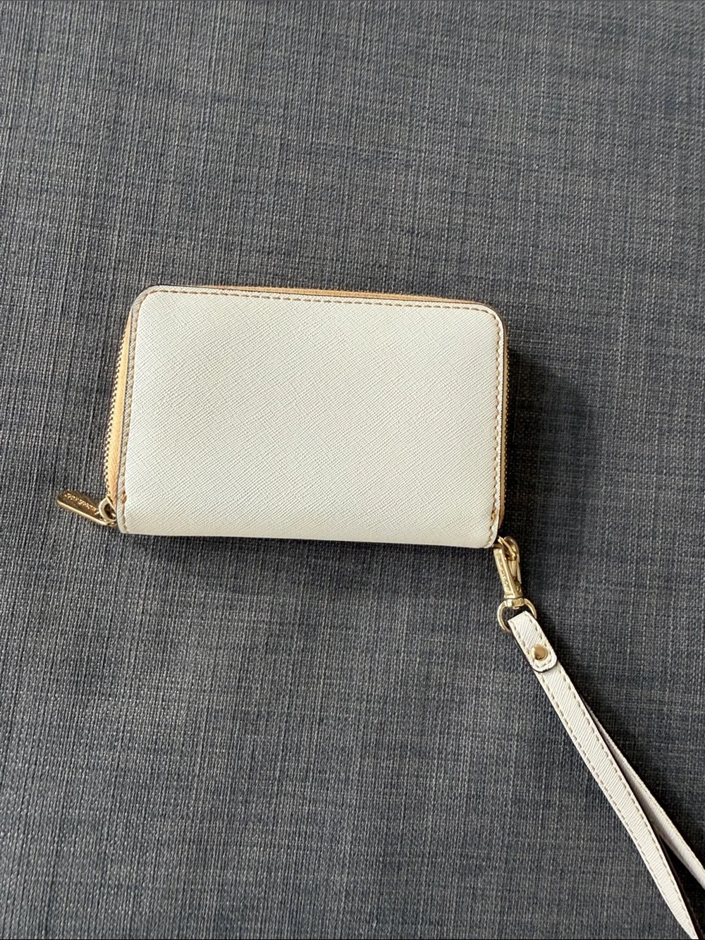 Michael Kors Cream Zip Wristlet with Gold Plaque